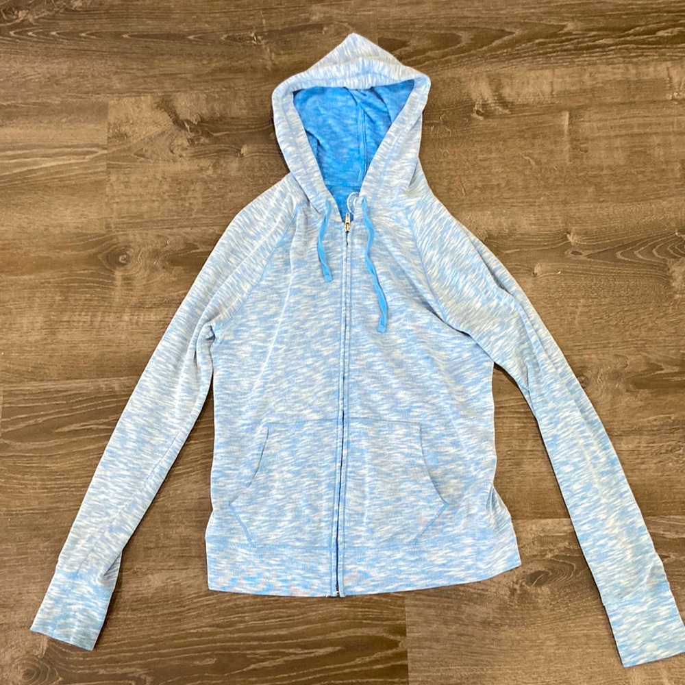 Light blue long sleeve zip up hoodie sweater.